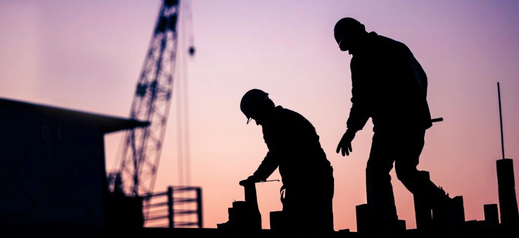 Workers on construction site - Construction industry trends.